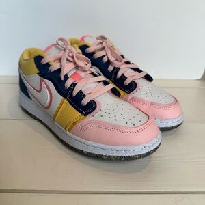 Nike Air Jordan 1 Low SE GS Big Kid Girl’s Pink, Yellow, and Blue Sneakers